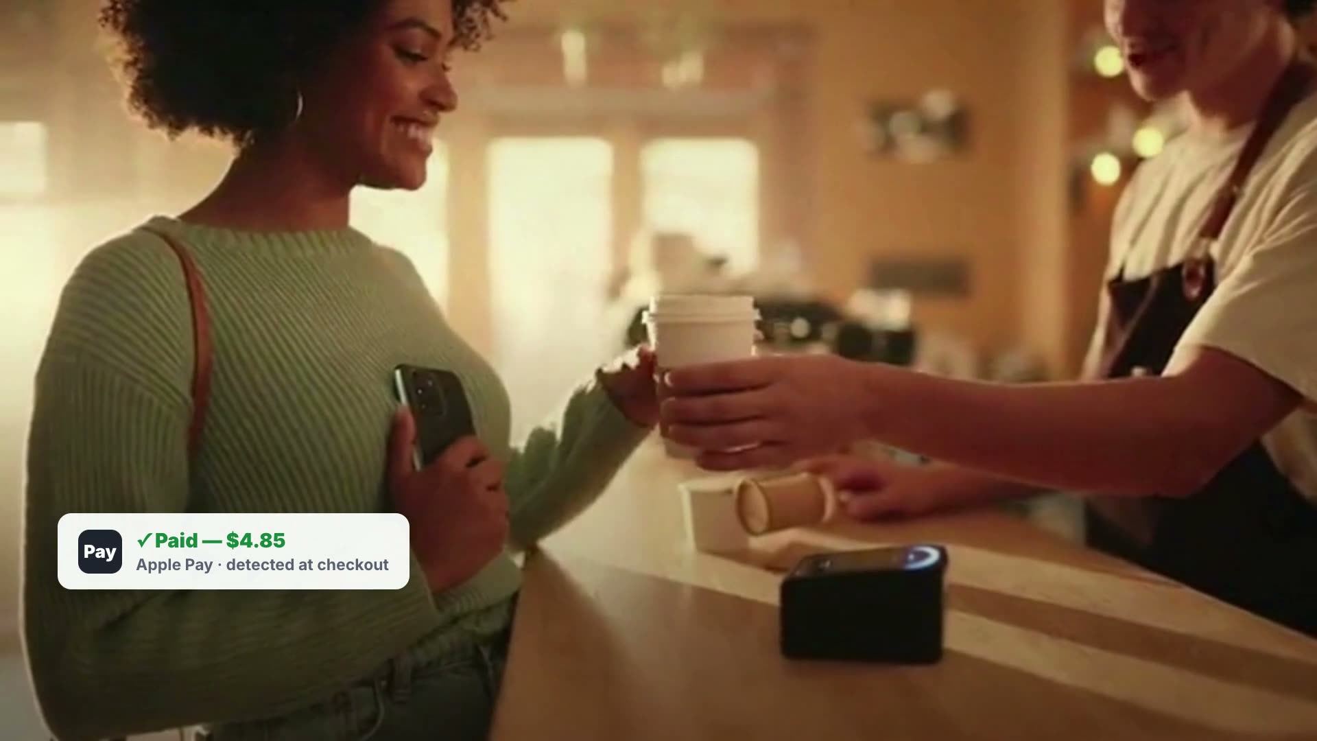 Guest paying by tap at the counter